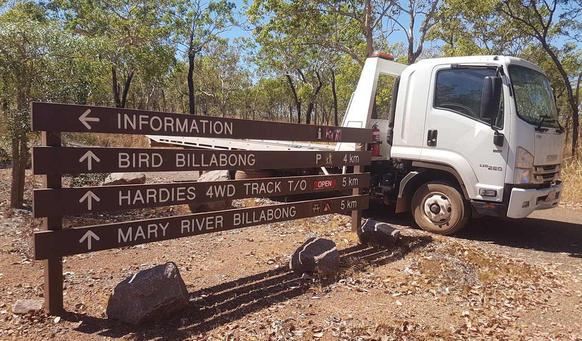 Berry Springs Tow Truck near sign